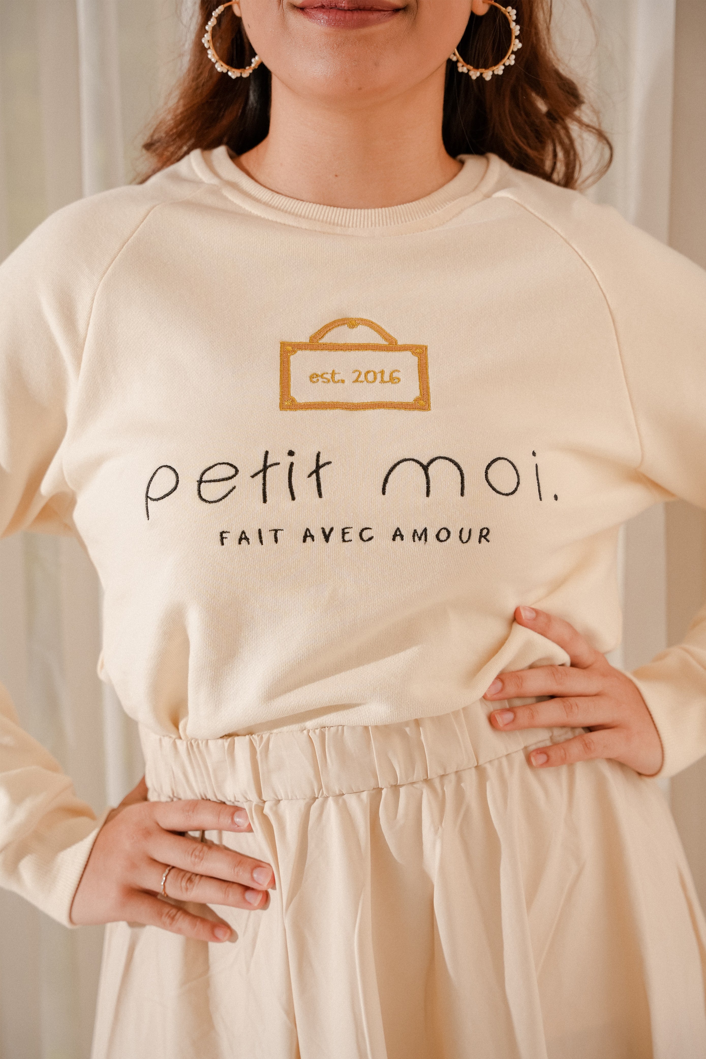 closeup shot of female model wearing high quality jumper made by petit moi