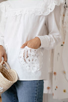 lady with white top and jeans from Petit Moi