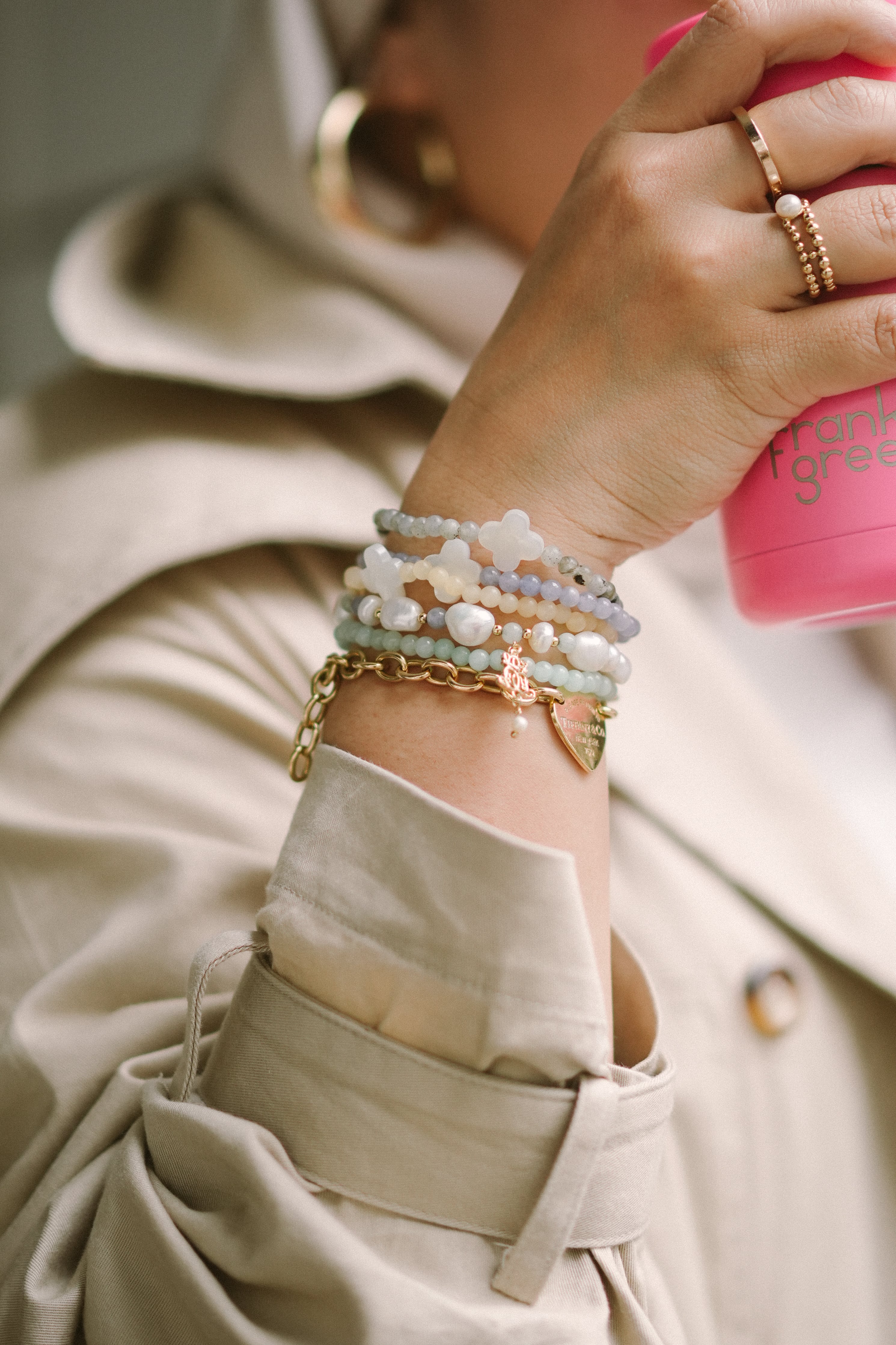 hand model wearing various bracelets designed by petit moi