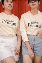 two female models in petit moi jumper
