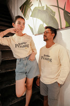 two models wearing petit moi jumper and posing by the stairs