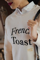 Closeup shot of female model in high quality sweater made by petit moi