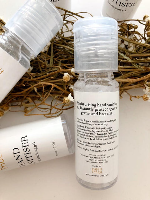 High quality hand sanitiser made by petit moi. arranged on a white table