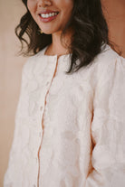 woman in high quality white baju kurung
