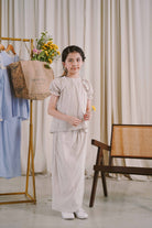 girl in grey and white baju kurung from Petit Moi
