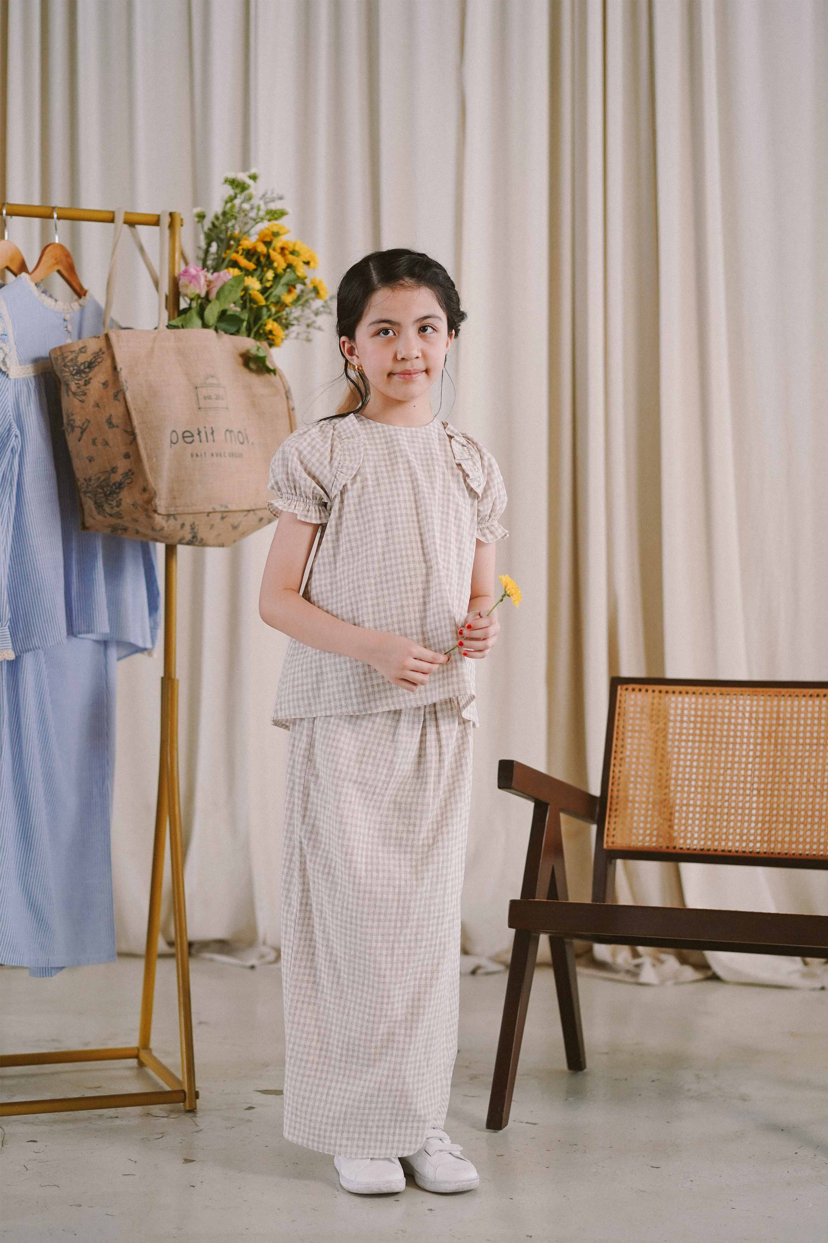 girl in grey and white baju kurung from Petit Moi