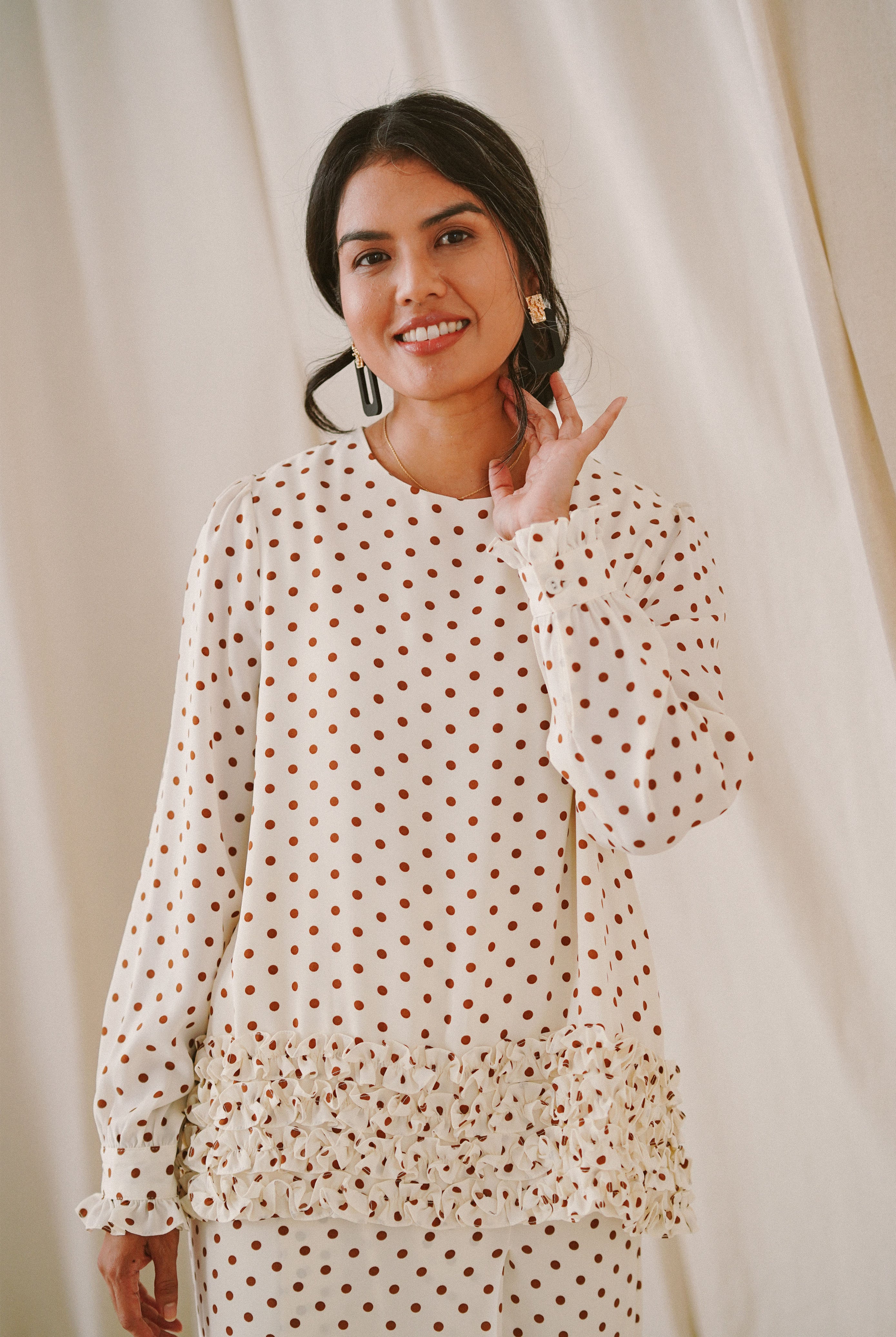 female model in high quality polka dotted baju kurung by Petit Moi