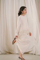 female model in polka dotted baju kurung