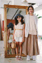 Mother and daughter in high quality polka dotted baju kurung by Petit Moi