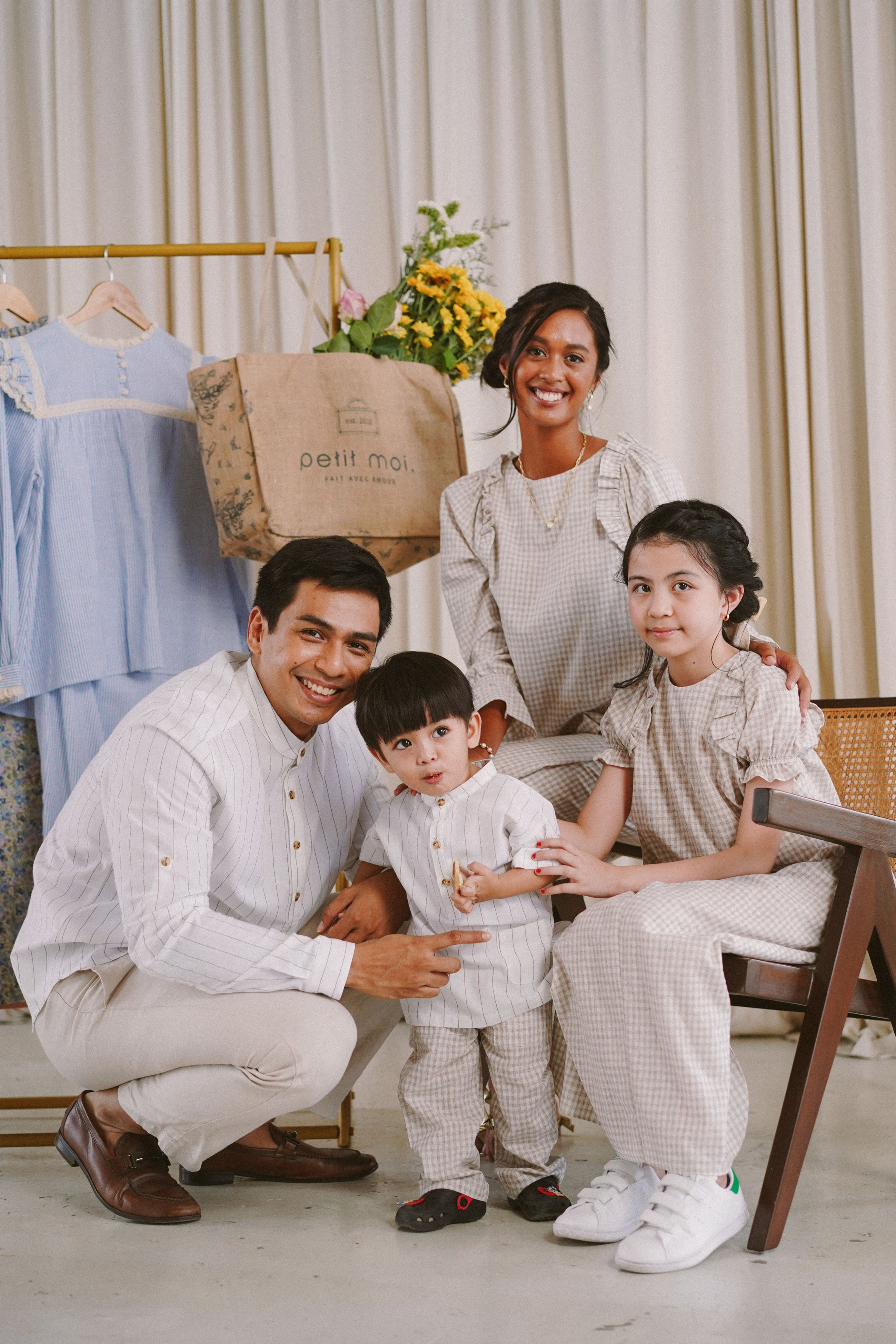 family in matching modern Malaysian clothing by Petit Moi