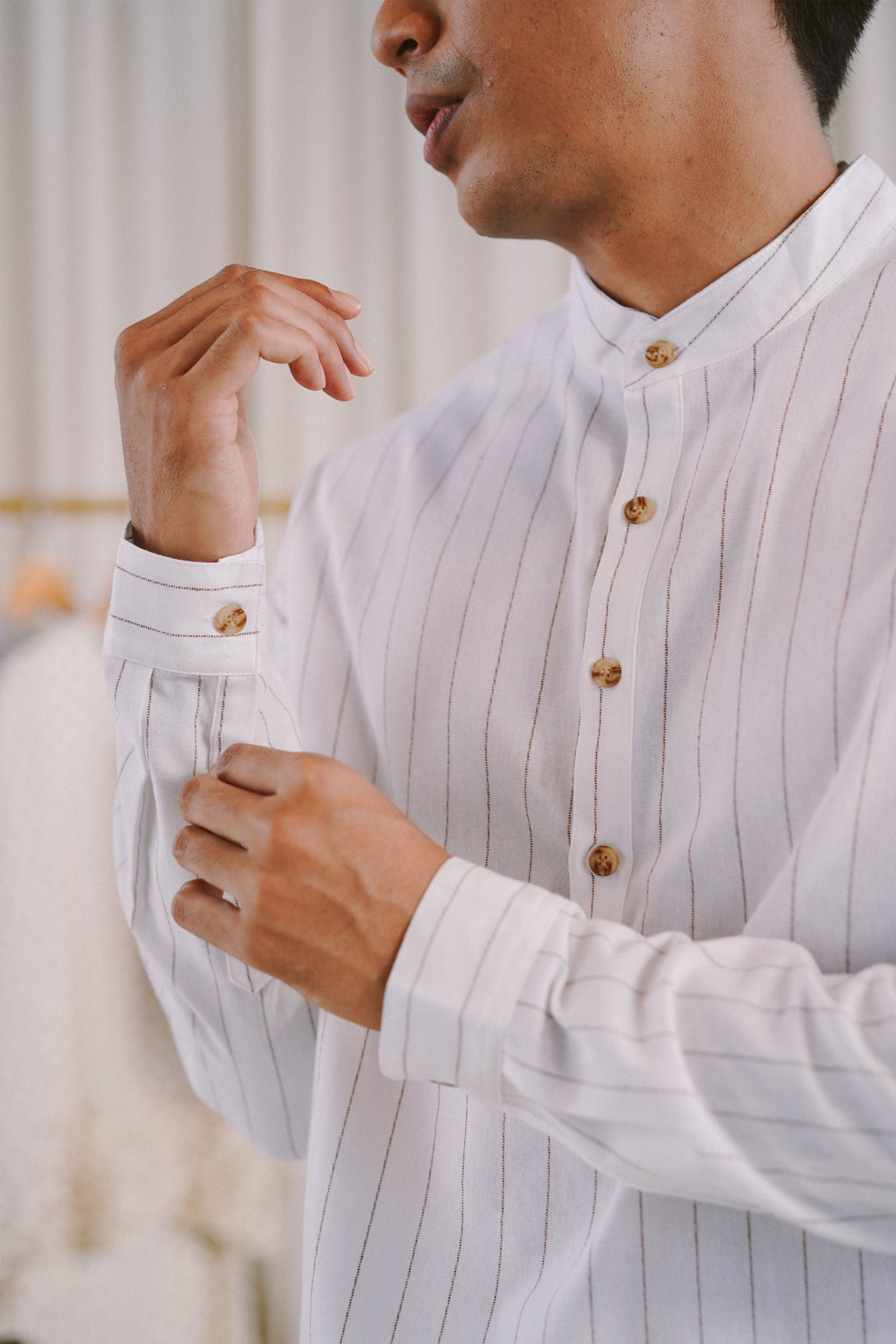 male model in white striped kurta by Petit Moi