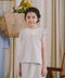 Little girl wearing her favourite light blue dress by petit moi
