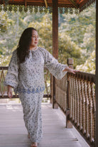 Mature woman wearing blue floral baju kurung made by petit moi