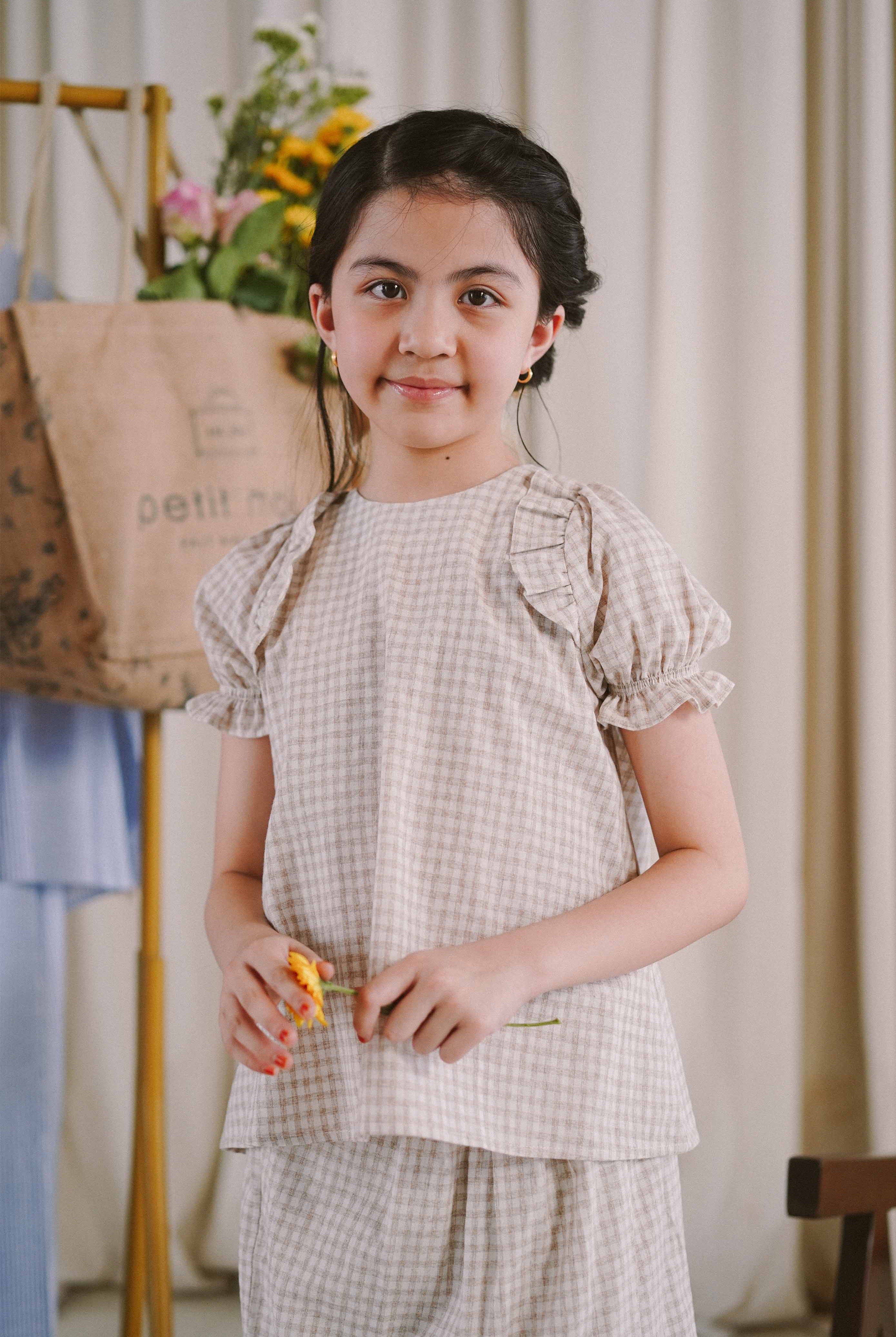 girl in grey and white checkered baju kurung from Petit Moi