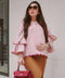 pregnant mother wearing a pink blouse by petit moi