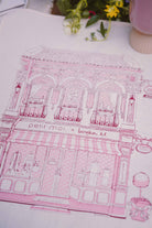 pink bingka tea towel laid out
