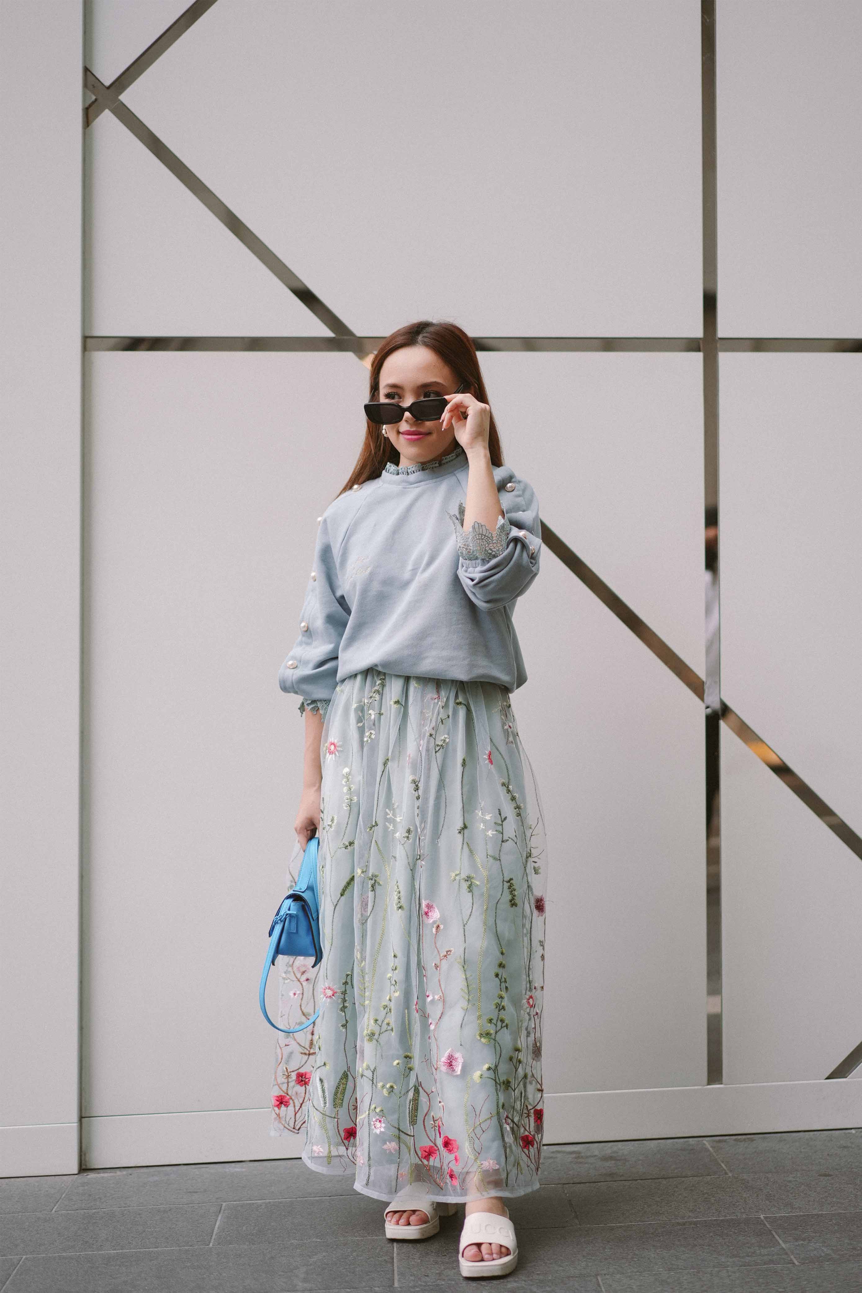 asian model posing in traditional clothing designed by petit moi