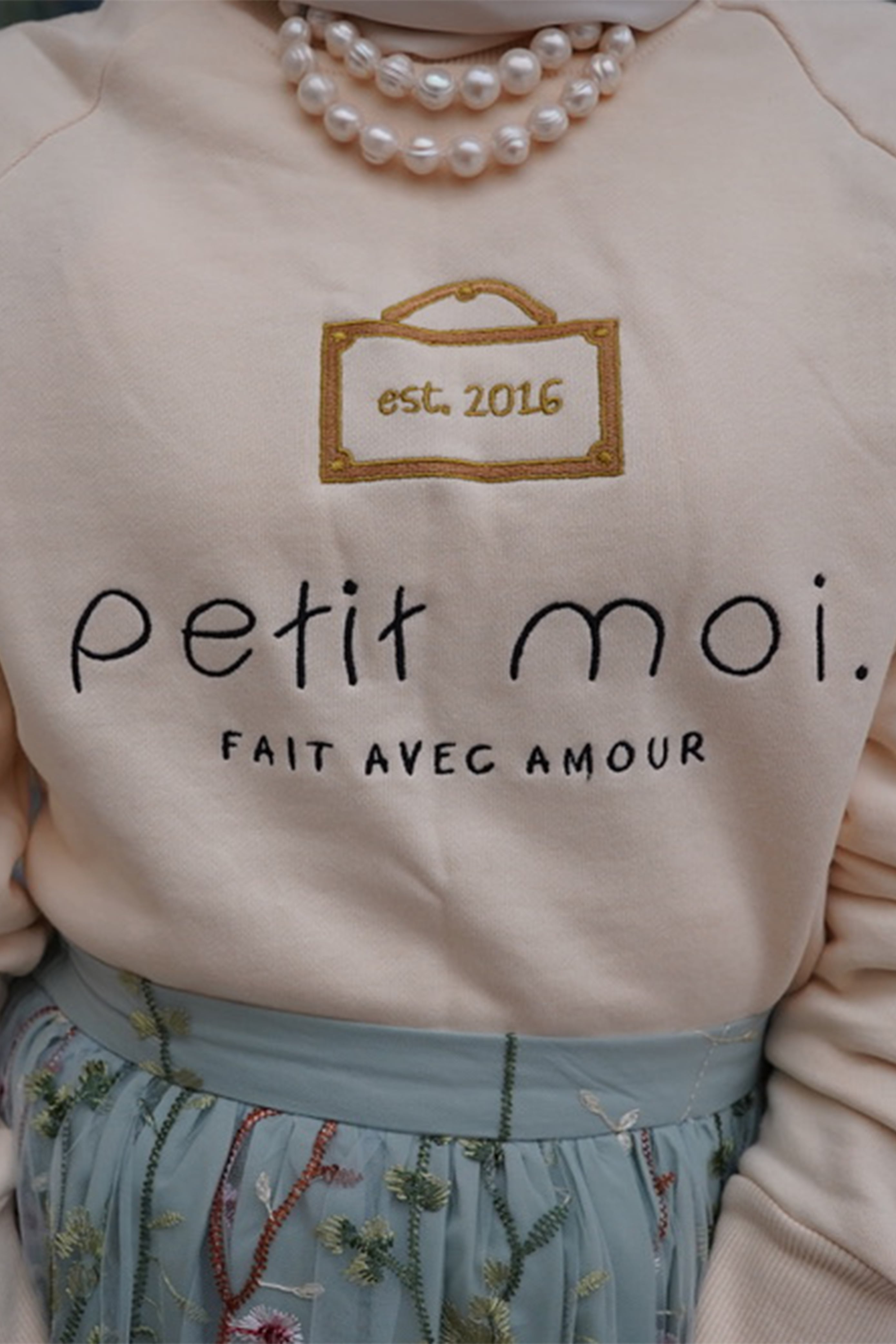 Closeup shot of high quality sweater made by petit moi