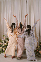 three bestfriends posing in baju kurung by petit moi