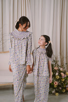 mother and daughter wearing matching petit moi baju kurung