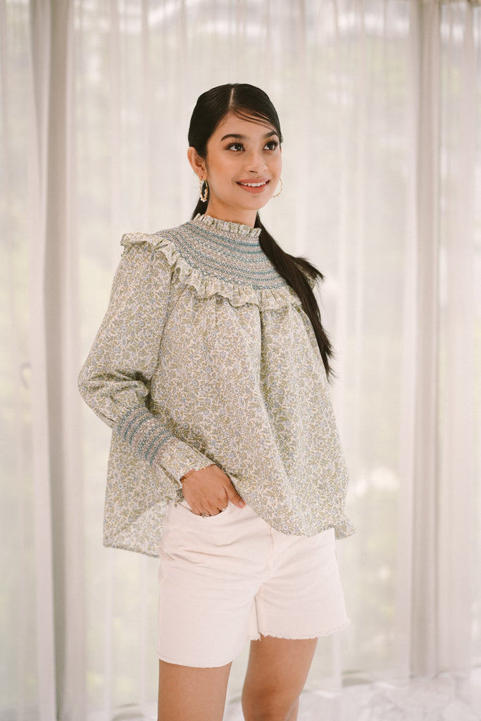 female model happily smiling in her new high quality modest top made by petit moi