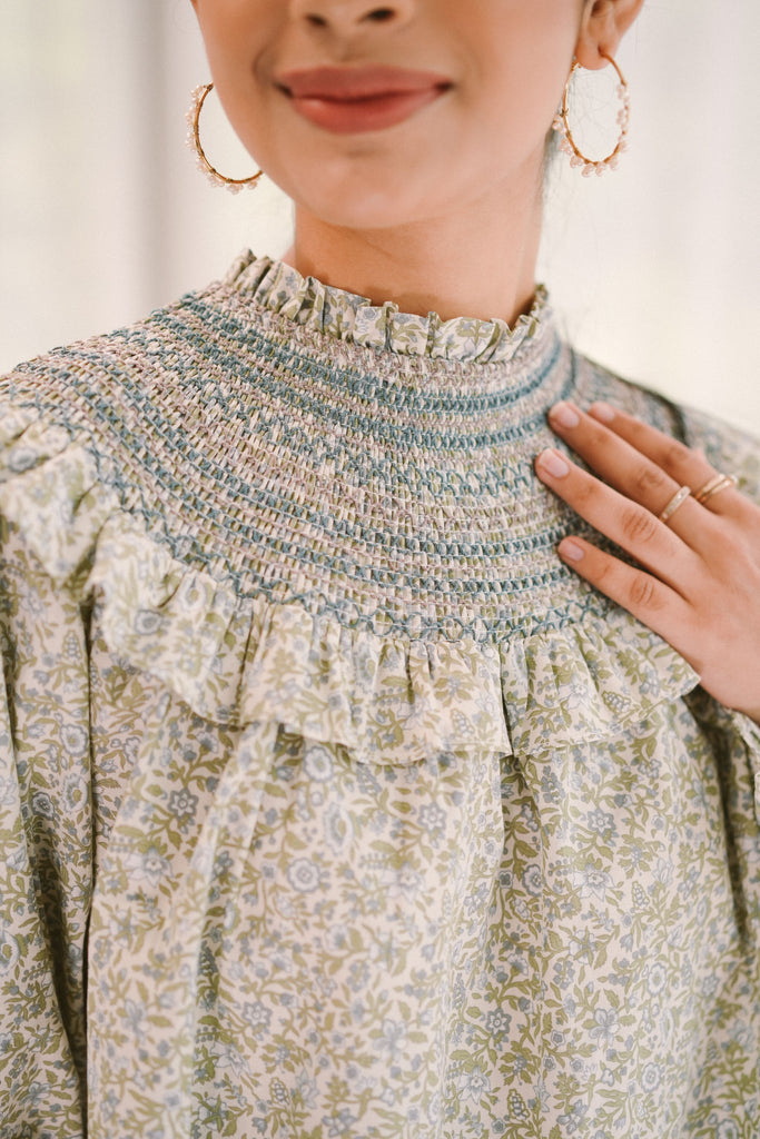 closeup shot of female model in high quality modest top by petit moi