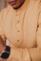 closeup picture of male model wearing yellow kurta by Petit Moi