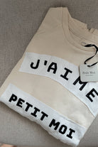 closeup shot of a high quality jumper made by petit moi