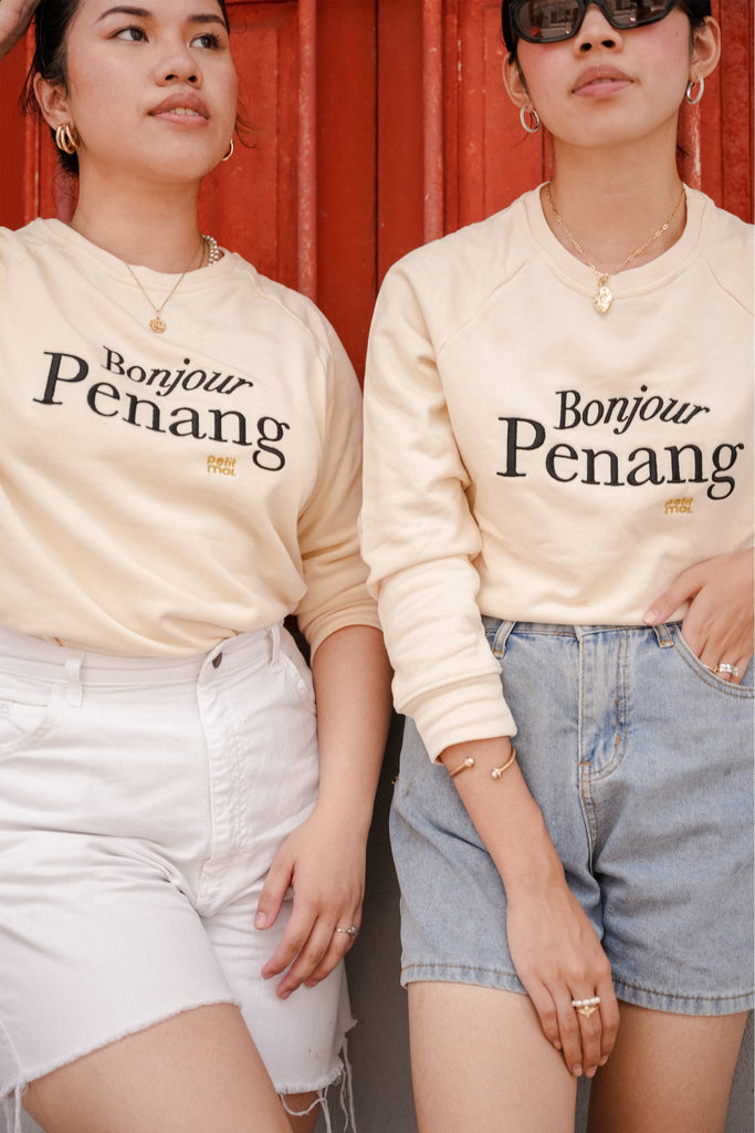 two female models in petit moi jumper