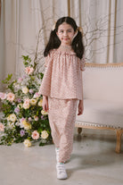 little girl modelling in high quality flowery baju kurung by Petit Moi
