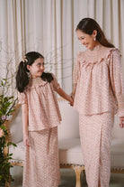 Mother and daughter in high quality matching baju kurung by Petit Moi