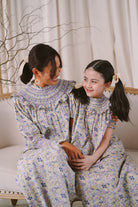 Mother and daughter in high quality matching baju kurung by Petit Moi