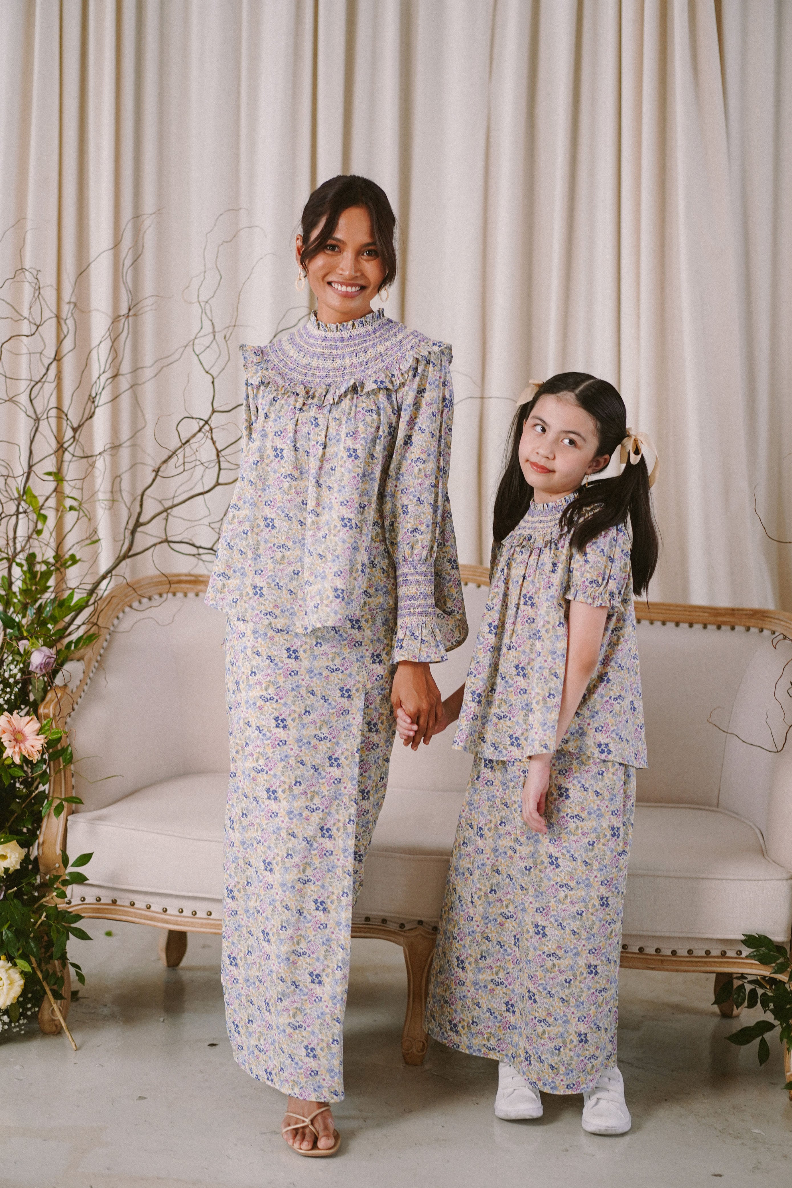 mother and daughter in high quality matching baju kurung by Petit Moi