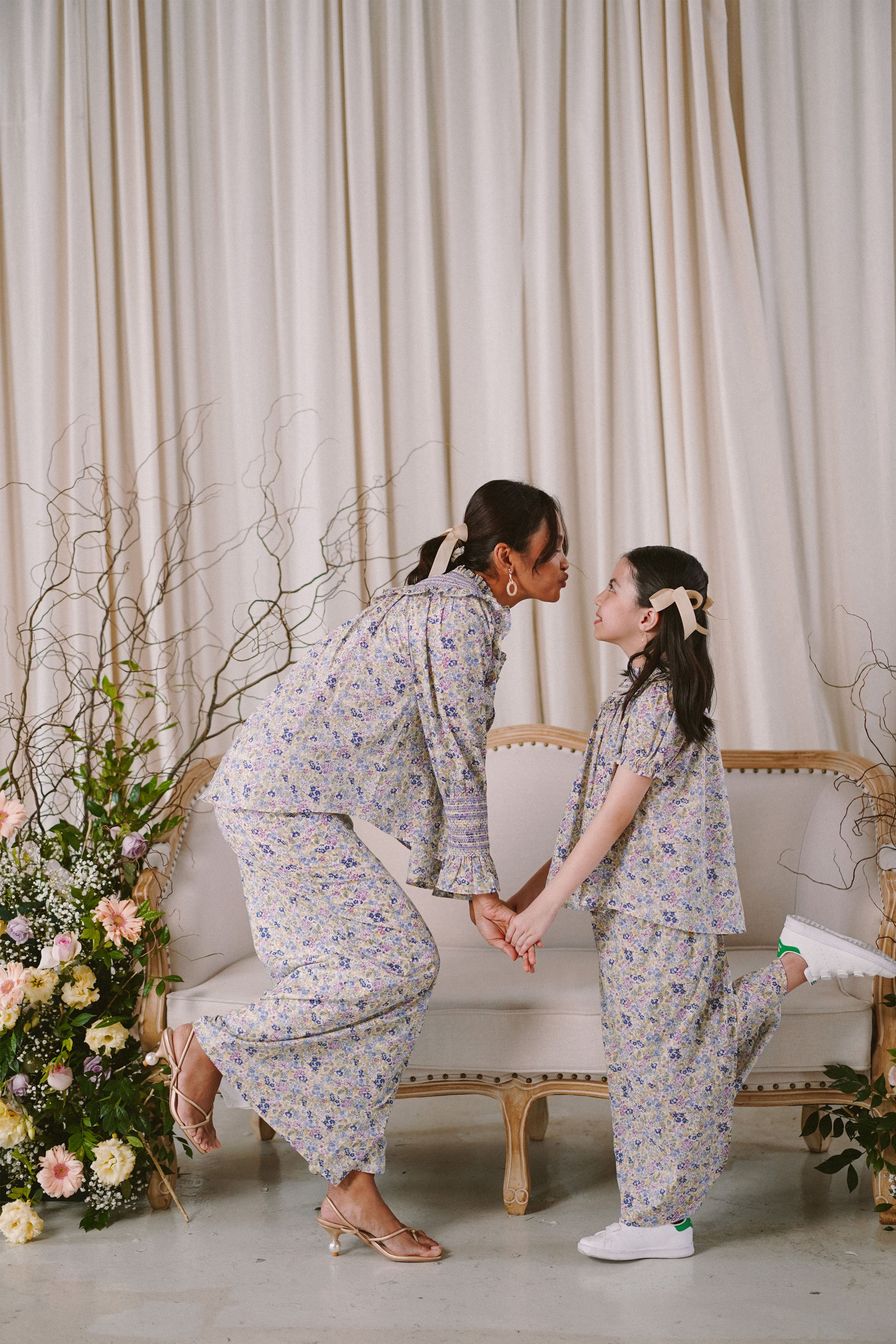 Mother and daughter in high quality matching baju kurung by Petit moi