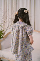 Little girl modelling in high quality modern baju kurung by Petit Moi