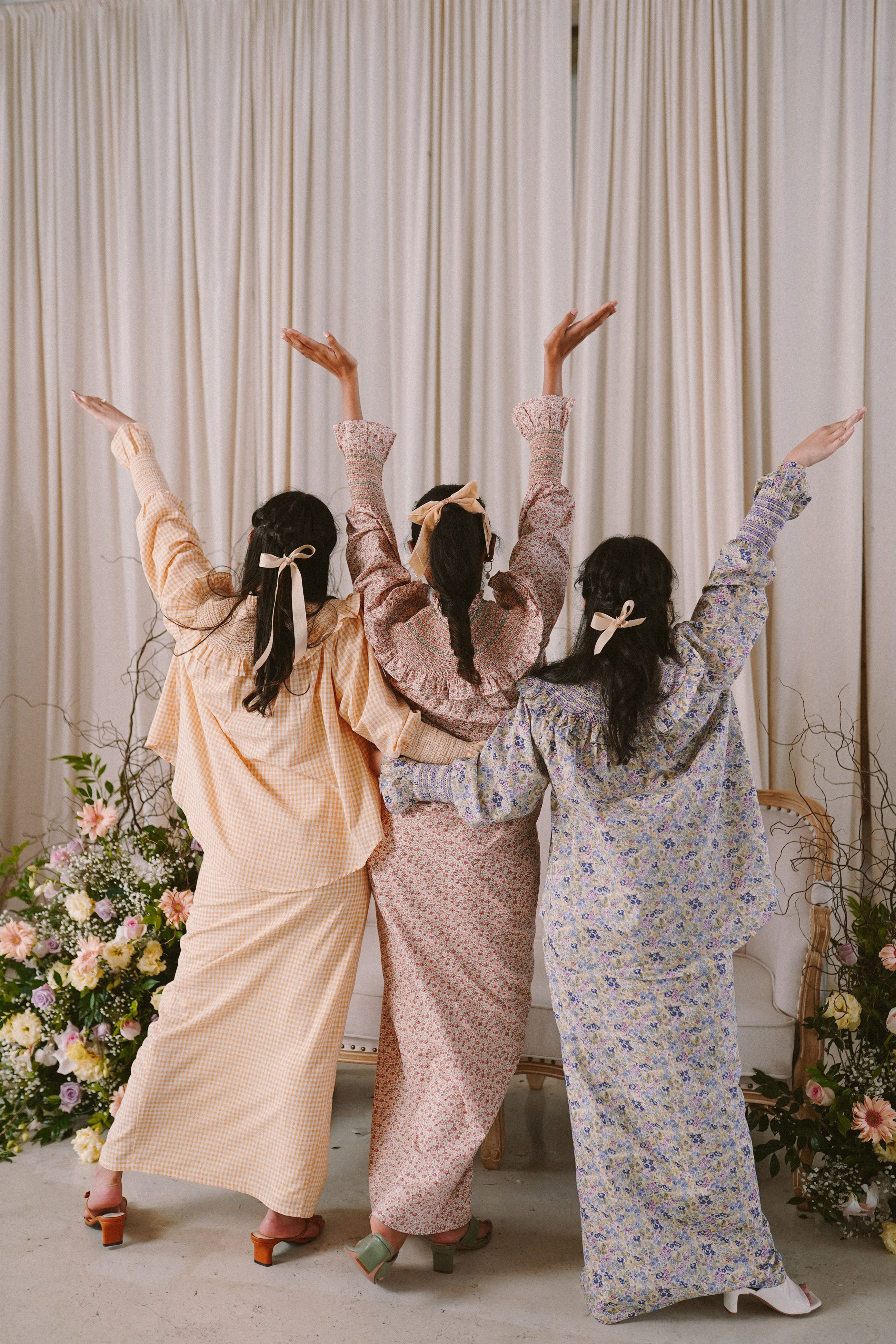 three bestfriends in baju kurung by petit moi posing for a candid shot