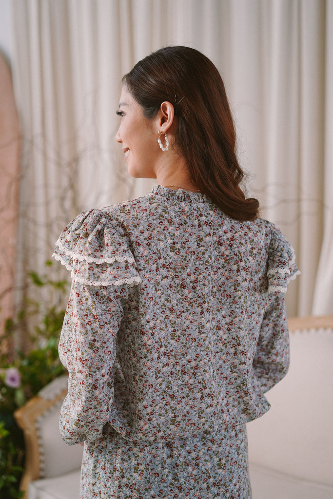 Backshot of female model in high quality baju kurung by petit moi