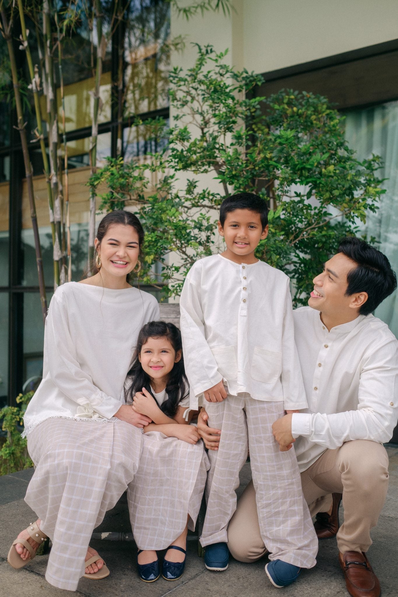 Family in high quality matching modern malaysian wear