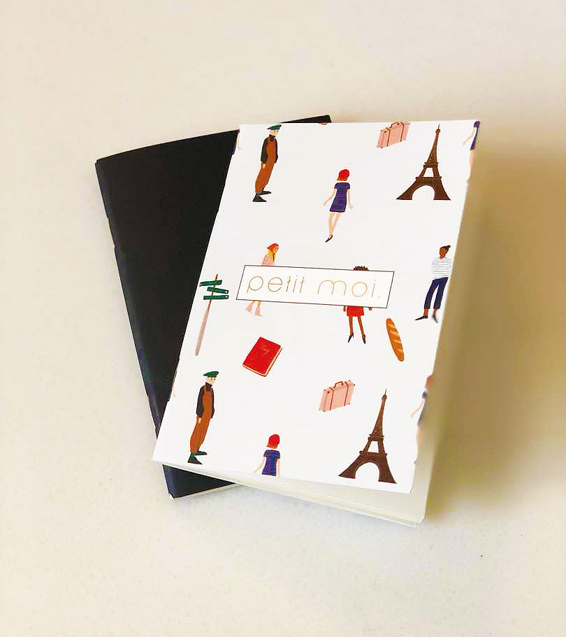 High quality notebooks made by petit moi. arranged on a white table