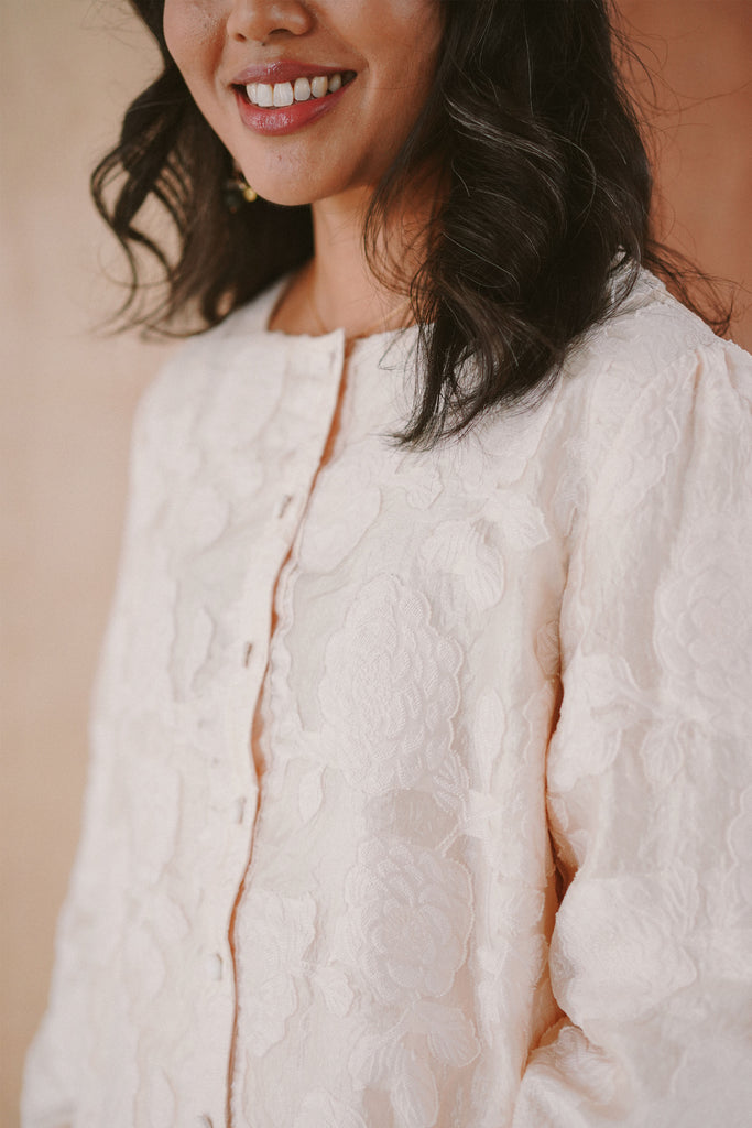 woman in high quality white baju kurung