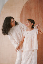 mother and daughter in pink baju kurung