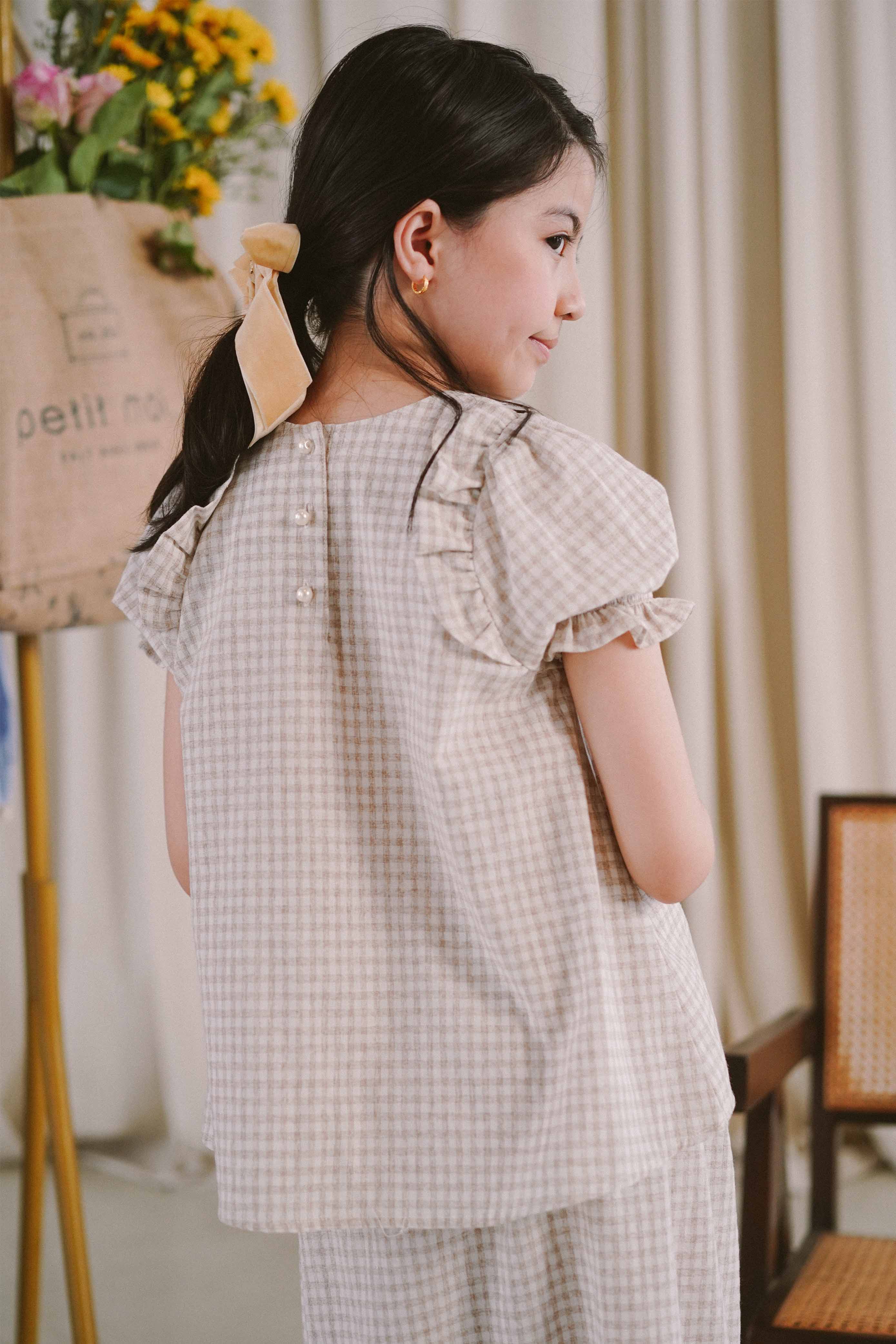 girl with white and grey checkered baju kurung from Petit Moi
