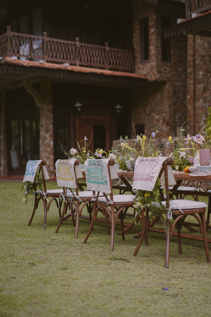 Petit moi bingka tea towels on chairs