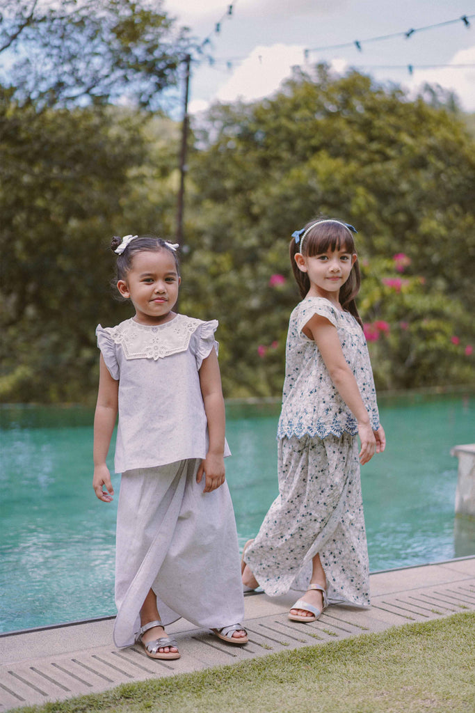 sisters in high quality modern baju kurung by Petit Moi