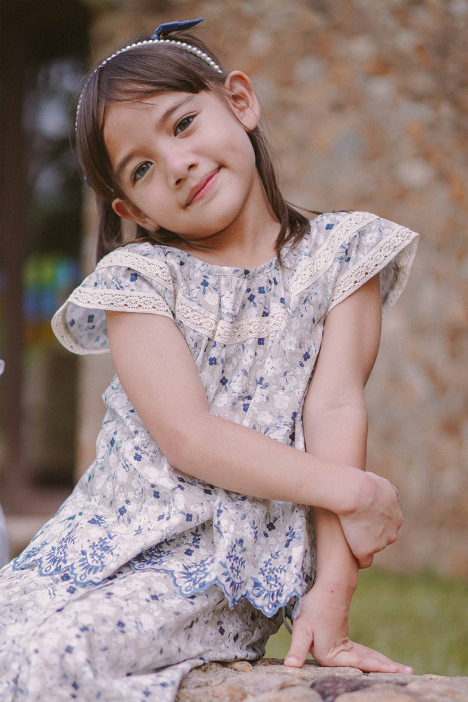 little girl in flowery baju kurung by Petit Moi