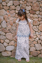 little girl in modern flowery baju kurung by Petit Moi