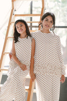 mother and daughter in matching polka dotted baju kurung by Petit Moi