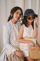 Mother and daughter in matching polka dotted baju kurung by Petit Moi