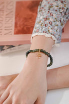 Woman wearing high quality bracelet by Petit Moi