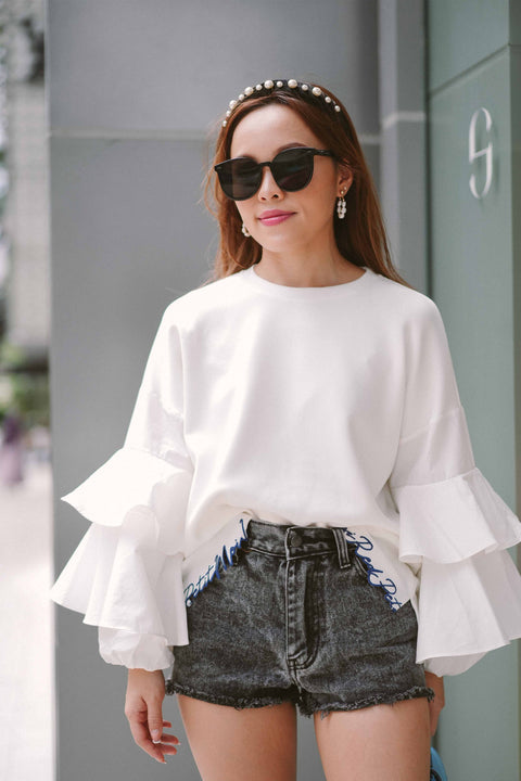 female model in casual top by petit moi